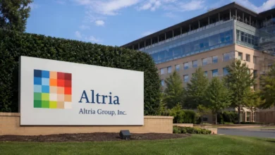 Stock market ticker board showing mixed index and Altria share price movement