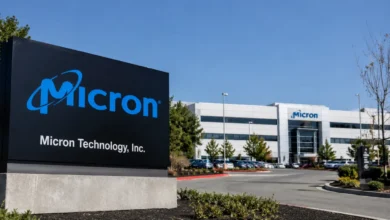 Stock market ticker display showing declining semiconductor stock prices